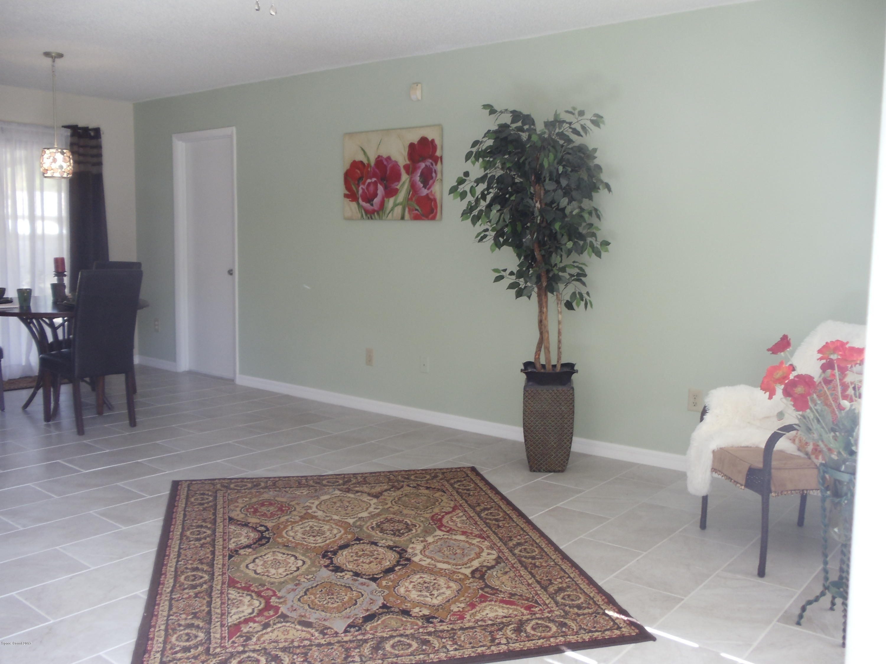 271 Trilby Road Southwest Palm Bay, FL 32908 - Photo 7 of 27 a living room with furniture