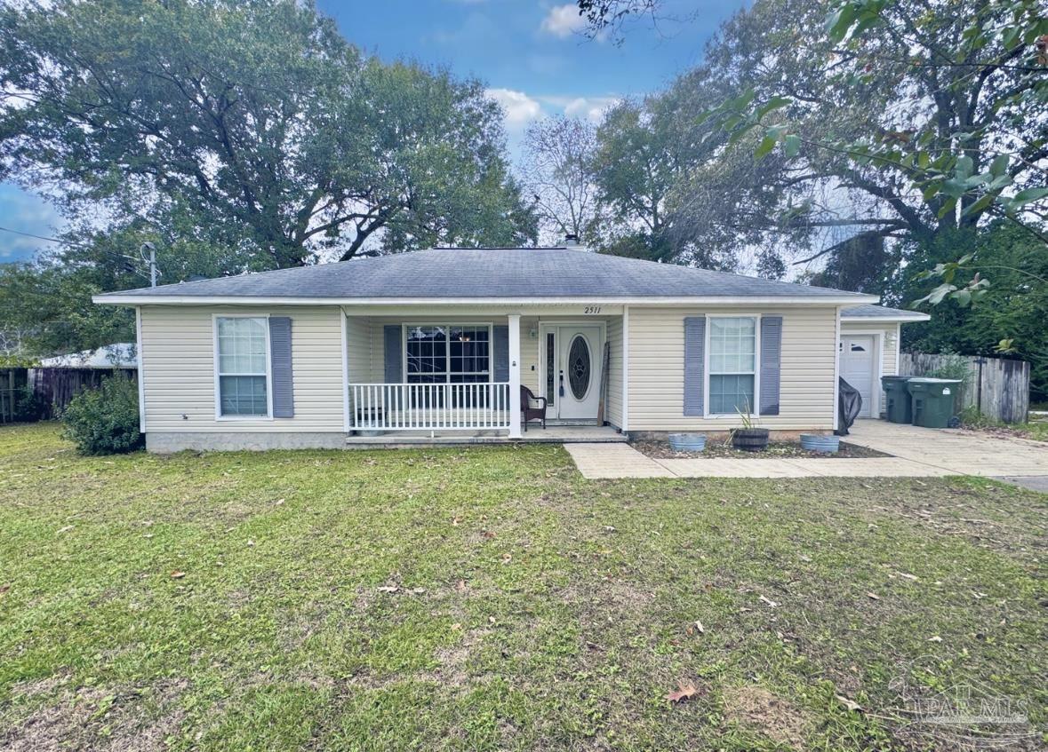 a view of house with backyard and swimming pool