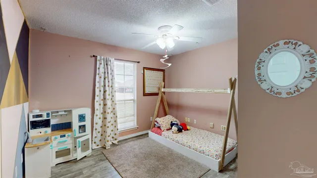 a bedroom with furniture and a chandelier