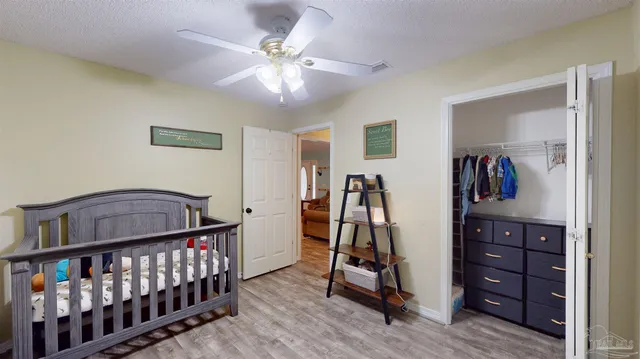 a view of a hallway with entryway wooden floor and front door
