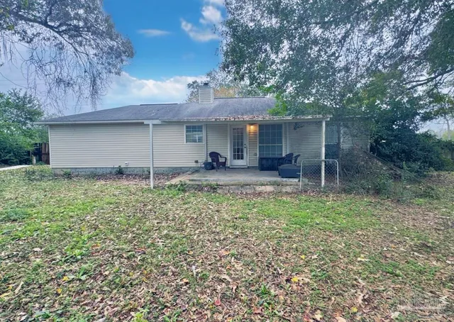 a house view with a backyard space