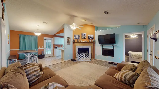 a living room with furniture and a clock