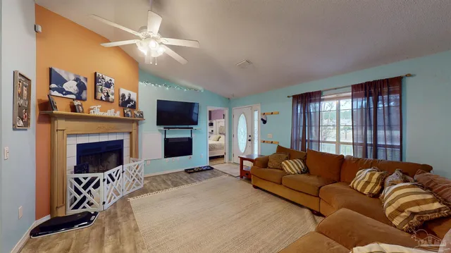a view of a dining room with a table and chairs