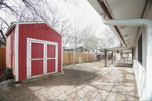 a view of a house with a snow in the yard