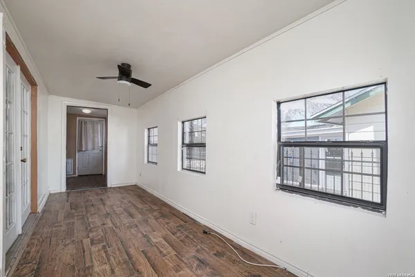a view of an empty room with a window