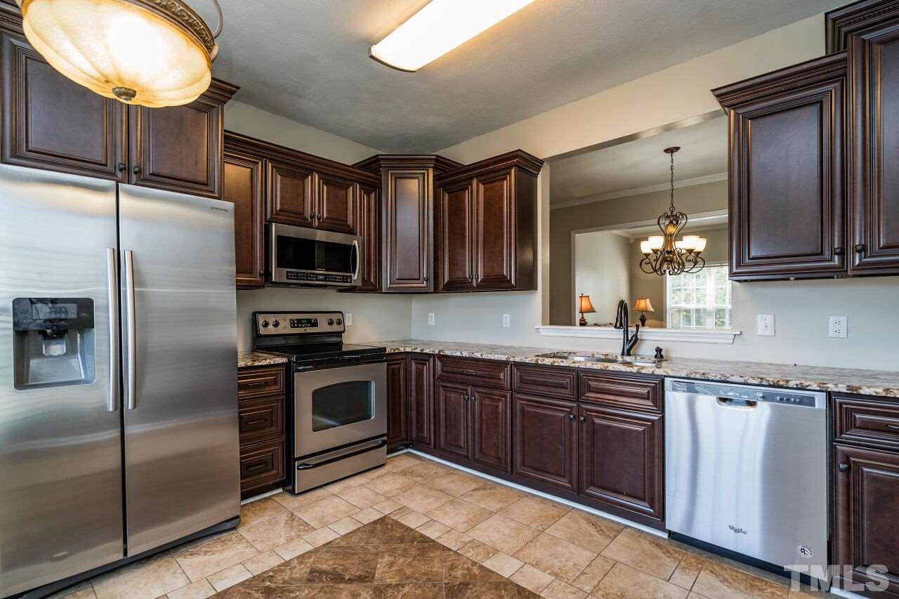 2905 Alder Ridge Lane Raleigh, NC 27603 - Photo 10 of 26 The well-designed kitchen has granite counters.