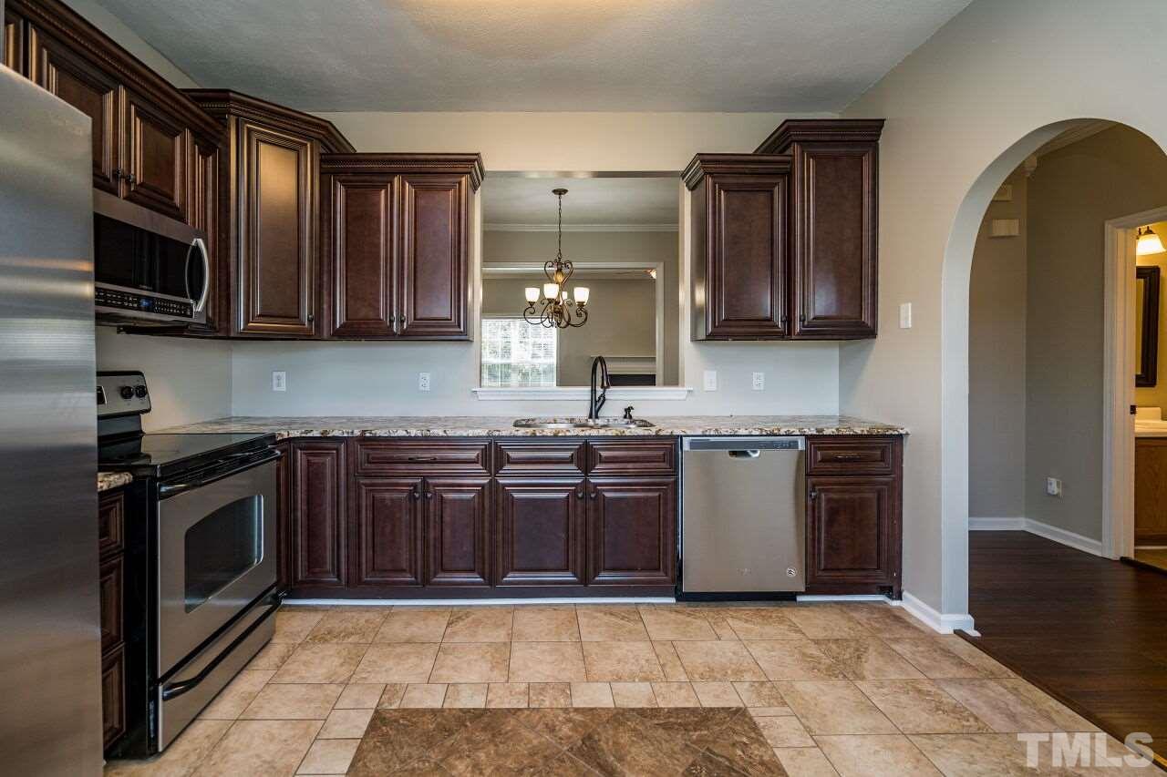 2905 Alder Ridge Lane Raleigh, NC 27603 - Photo 11 of 26 Three is abundant cabinet and counter space in this efficient kitchen.