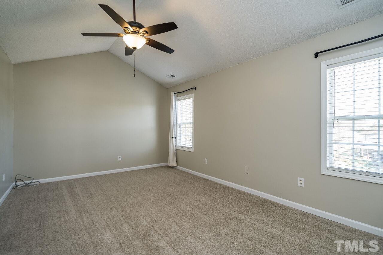 2905 Alder Ridge Lane Raleigh, NC 27603 - Photo 15 of 26 The private master suite has a vaulted ceiling.