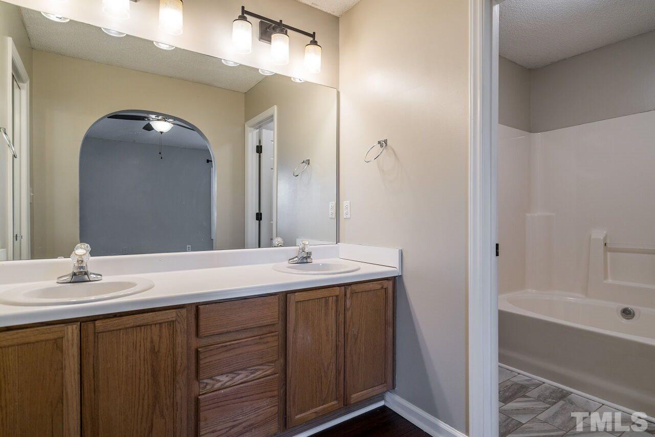 2905 Alder Ridge Lane Raleigh, NC 27603 - Photo 17 of 26 The master suite has a dual vanity and walk-in closet.
