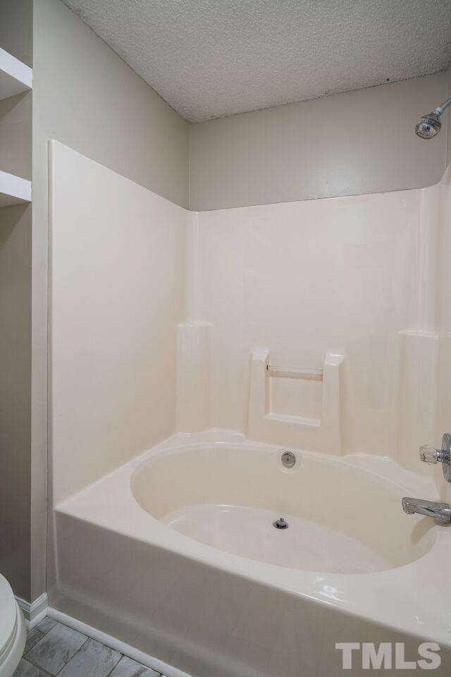 2905 Alder Ridge Lane Raleigh, NC 27603 - Photo 18 of 26 The master suite has a garden tub/shower combination.