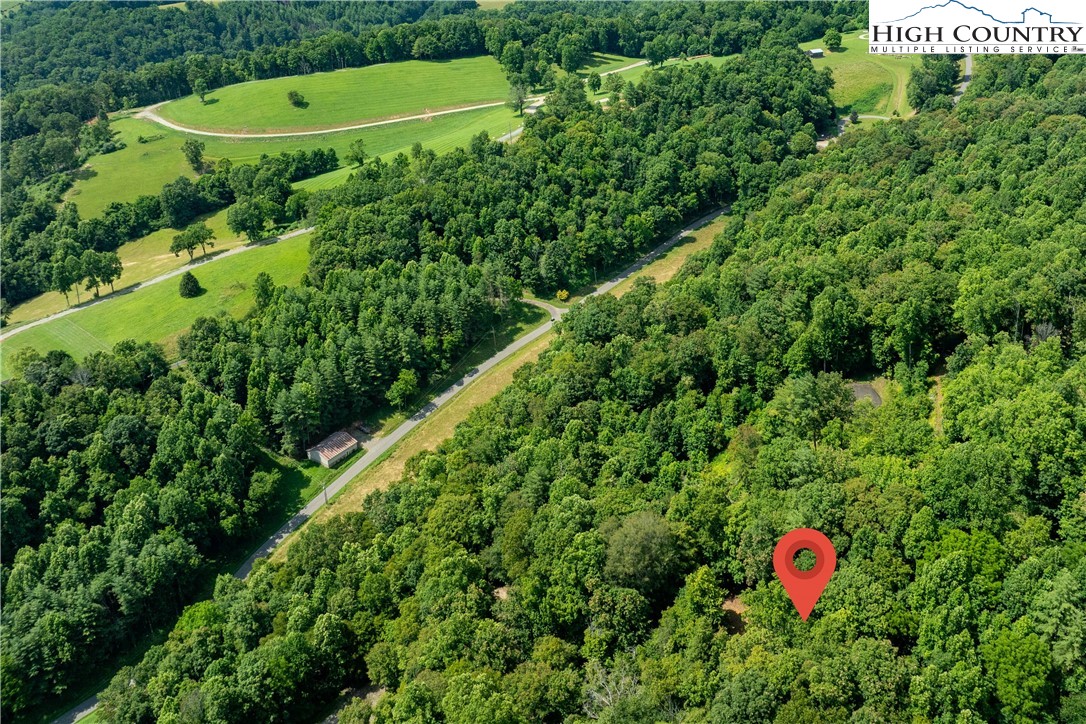 Lot 33 Lake Ridge Butler, TN 37640 - Photo 11 of 30 a backyard of a house with a yard and outdoor seating