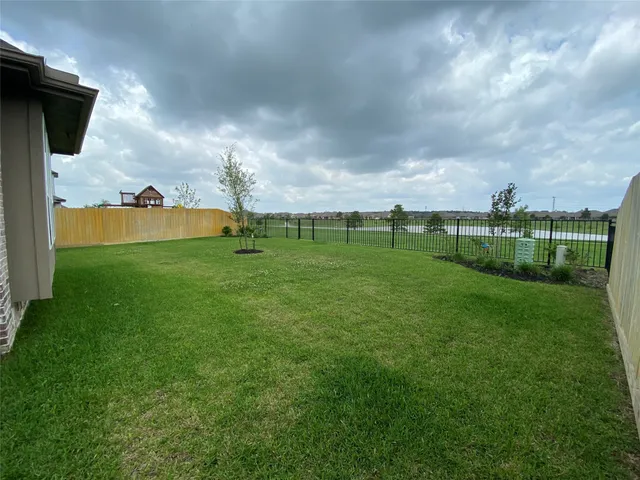 a backyard of a house with lots of green space