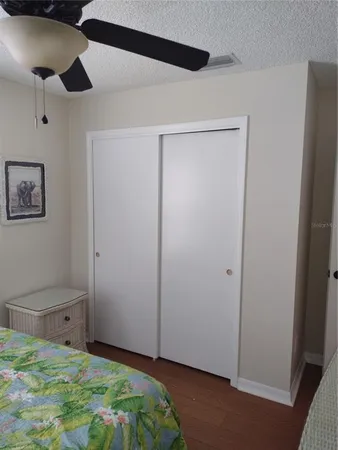 a room that has a bed and a closet in it