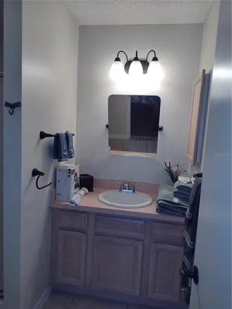 a bathroom with a double vanity sink and mirror