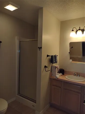 a bathroom with a sink and mirror