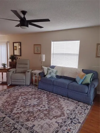 a living room with couches and a couch