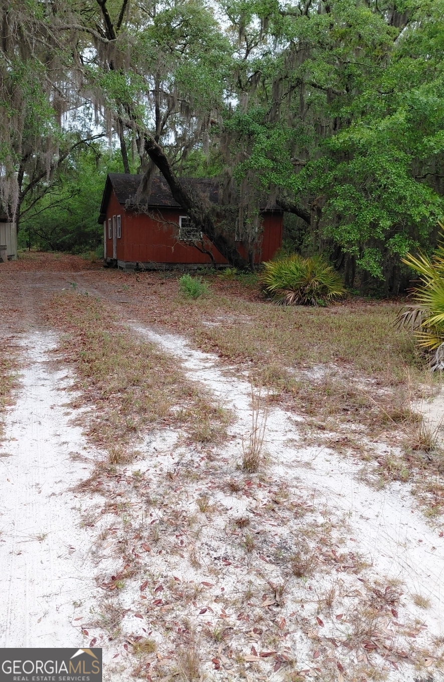 779 Ralph Davis Road, Unit 1 LAND LOT Folkston, GA 31537 - Photo 16 of 28 a view of a house with a yard and tree