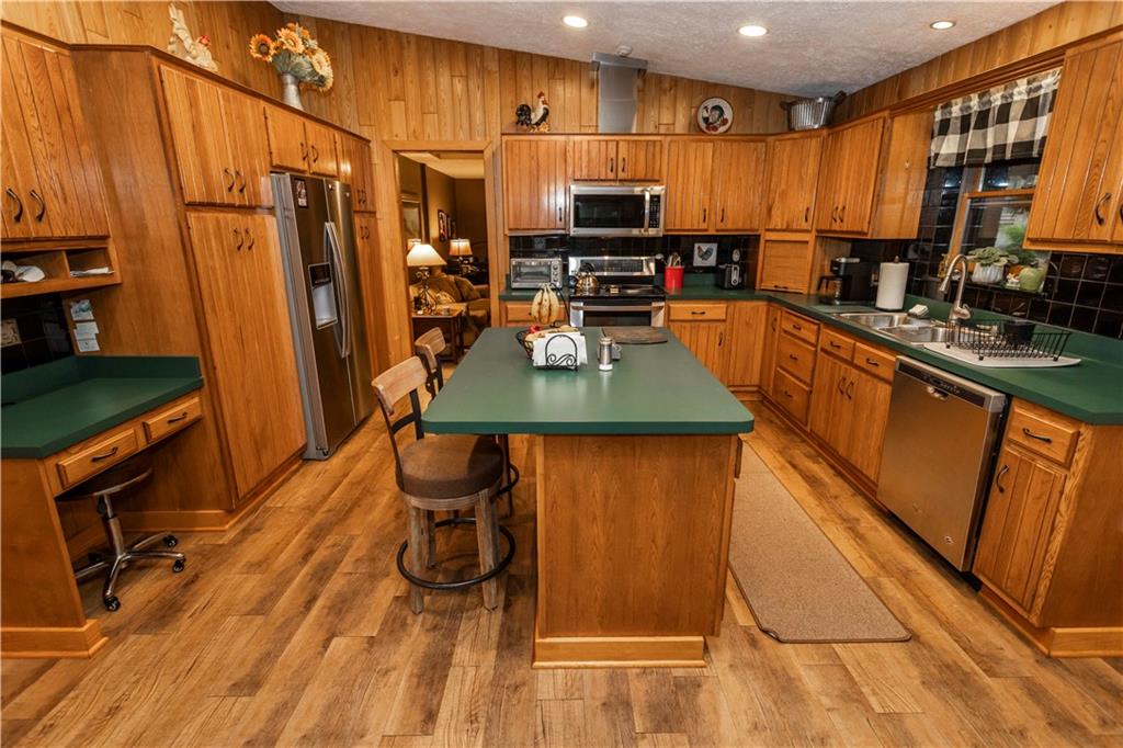 2488 County Line Road Champion, PA 15622 - Photo 11 of 50 a kitchen with stainless steel appliances granite countertop a refrigerator a stove top oven a sink and dishwasher