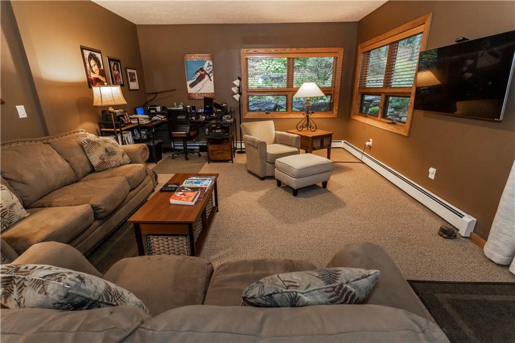 2488 County Line Road Champion, PA 15622 - Photo 15 of 50 a living room with furniture fireplace and a flat screen tv