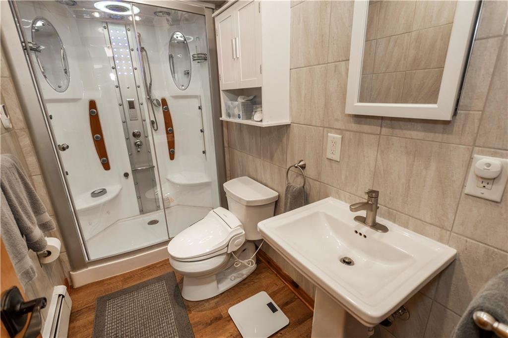 2488 County Line Road Champion, PA 15622 - Photo 25 of 50 a bathroom with a sink toilet and shower