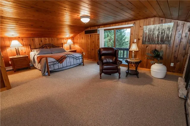 a bedroom with furniture and a chair