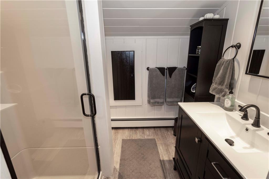 2488 County Line Road Champion, PA 15622 - Photo 29 of 50 a bathroom with a sink and mirror