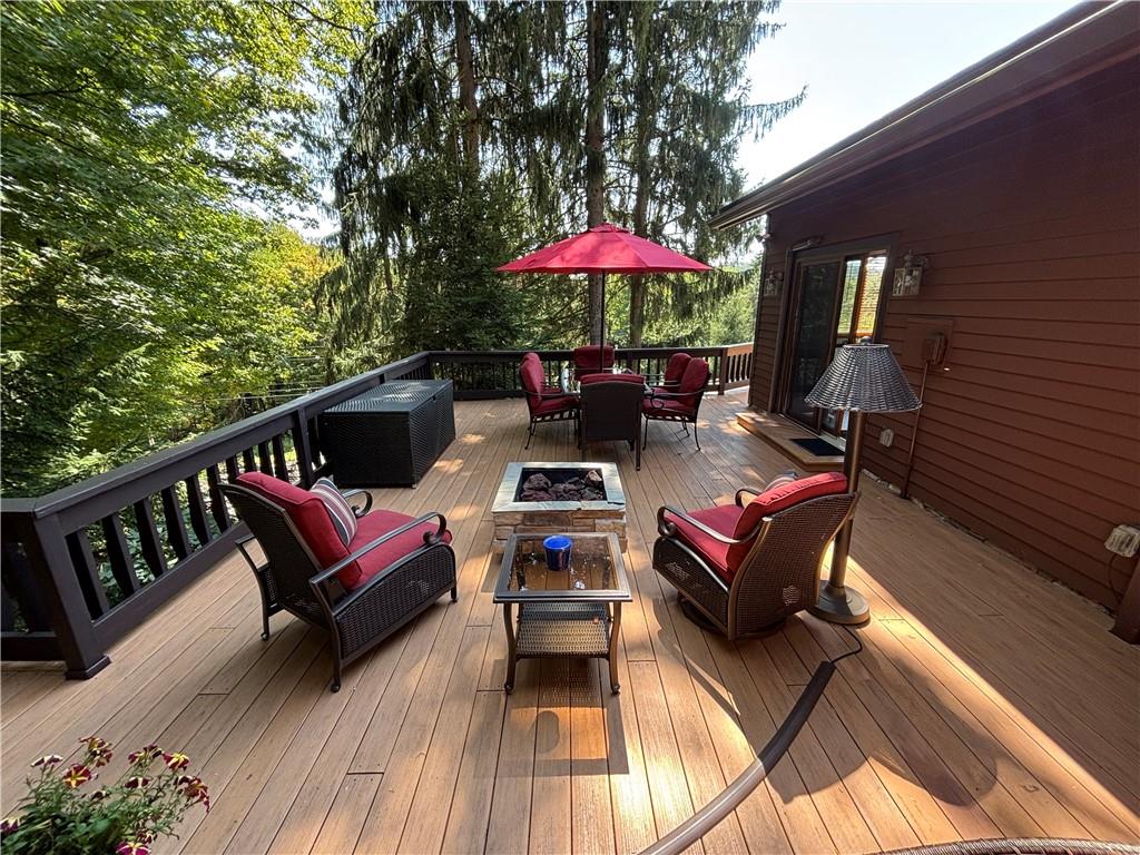 2488 County Line Road Champion, PA 15622 - Photo 35 of 50 an outdoor sitting area with furniture and wooden floor