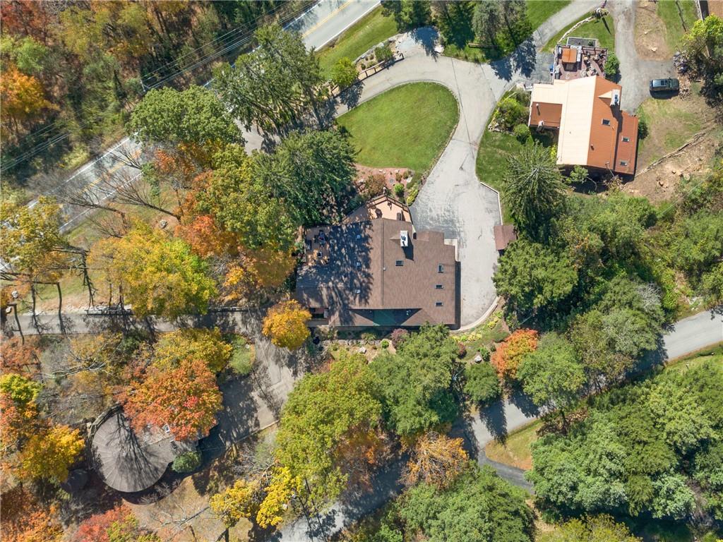 2488 County Line Road Champion, PA 15622 - Photo 47 of 50 an aerial view of a house with swimming pool and large trees