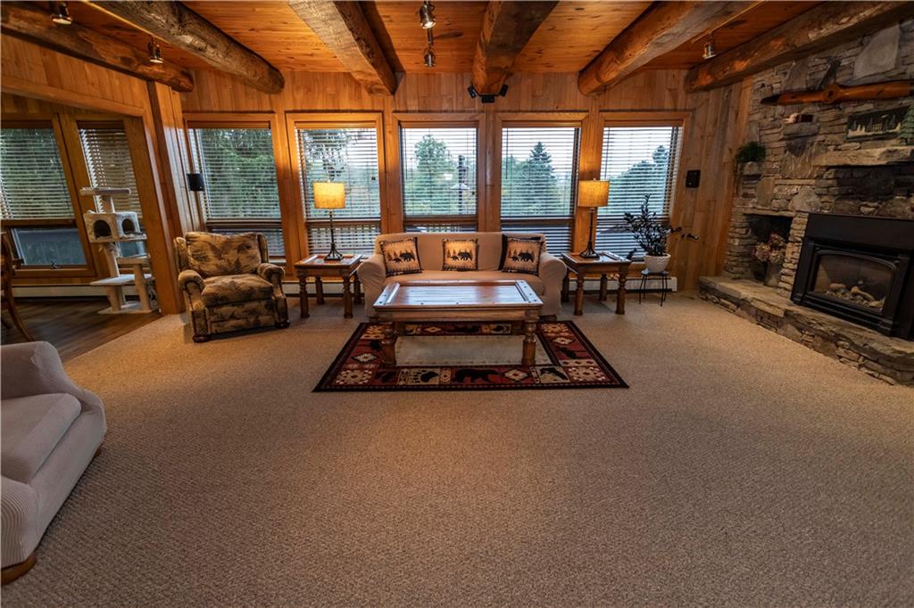2488 County Line Road Champion, PA 15622 - Photo 7 of 50 a living room with furniture and a fireplace