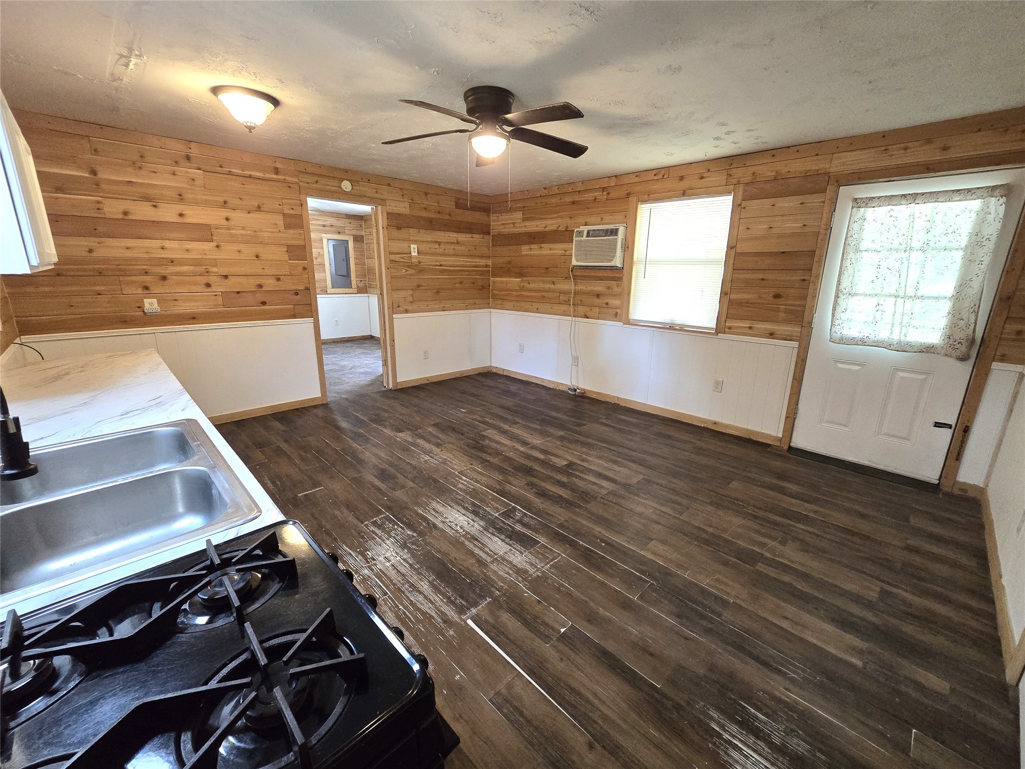 127 Navaho Trail Trinity, TX 75862 - Photo 1 of 13 a view of an empty room with wooden floor and a window