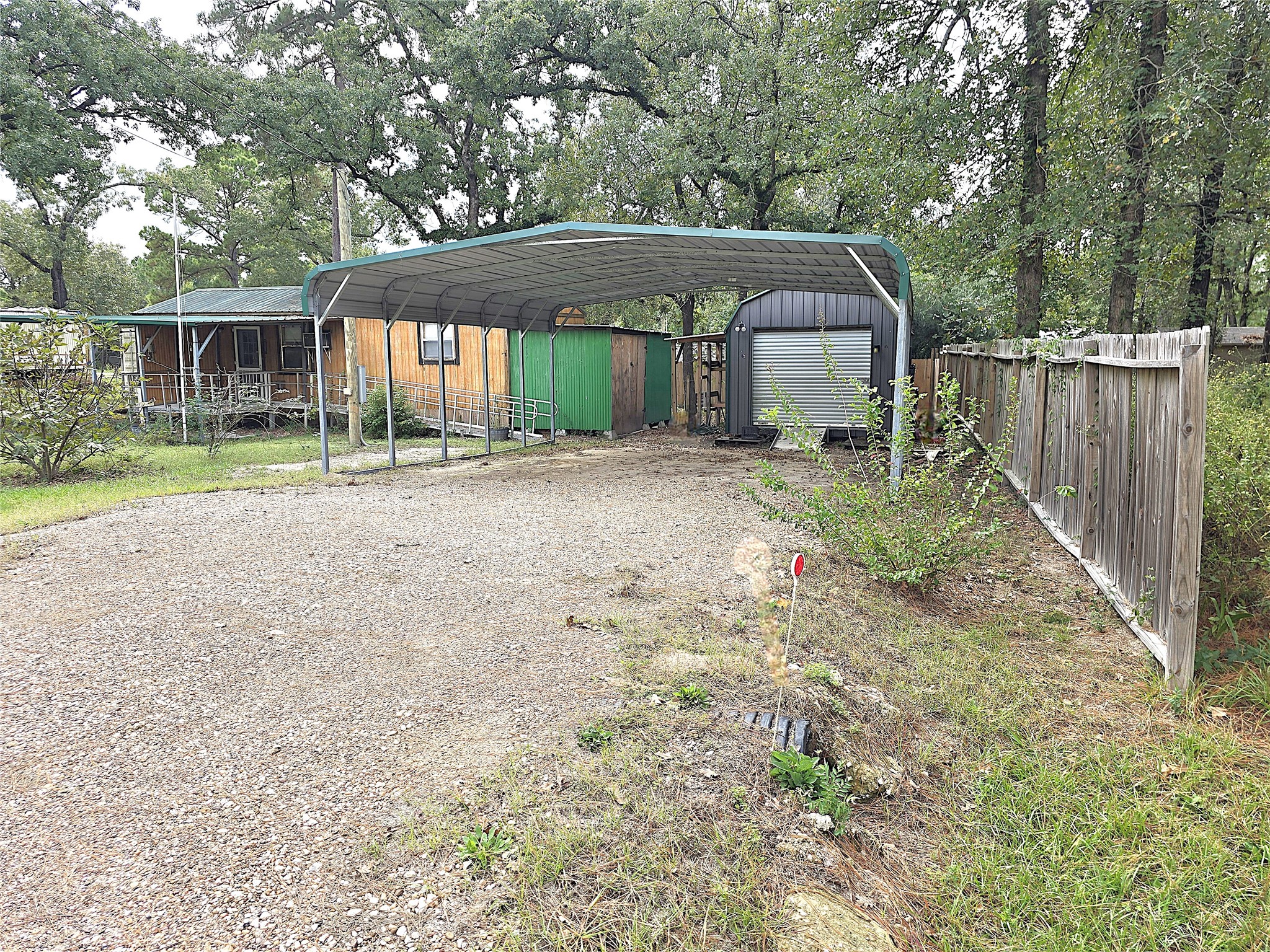 127 Navaho Trail Trinity, TX 75862 - Photo 2 of 12 a front view of a house with a yard and porch