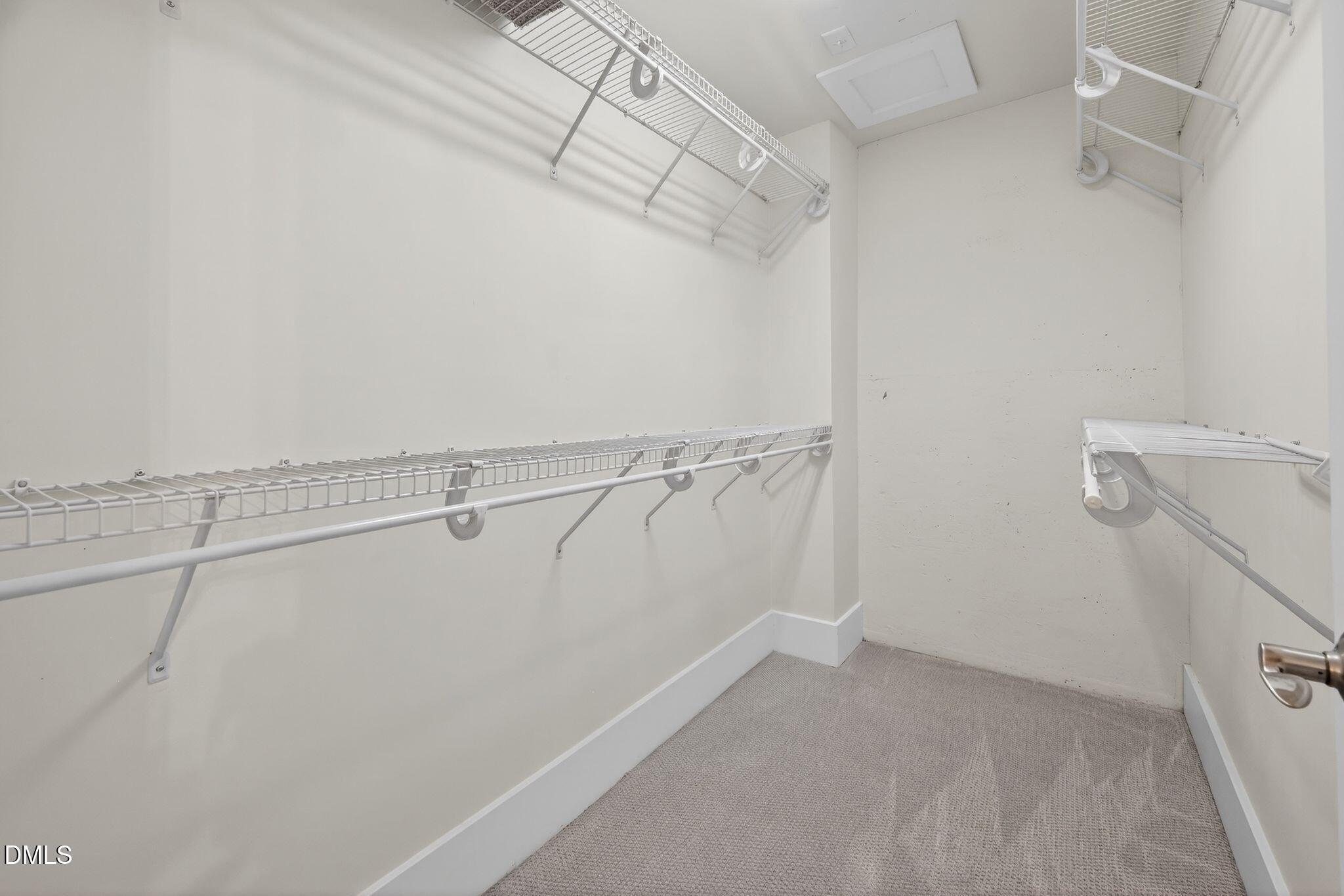 Undisclosed Address Raleigh, NC 27601 - Photo 16 of 25 a view of a room with racks on the wall