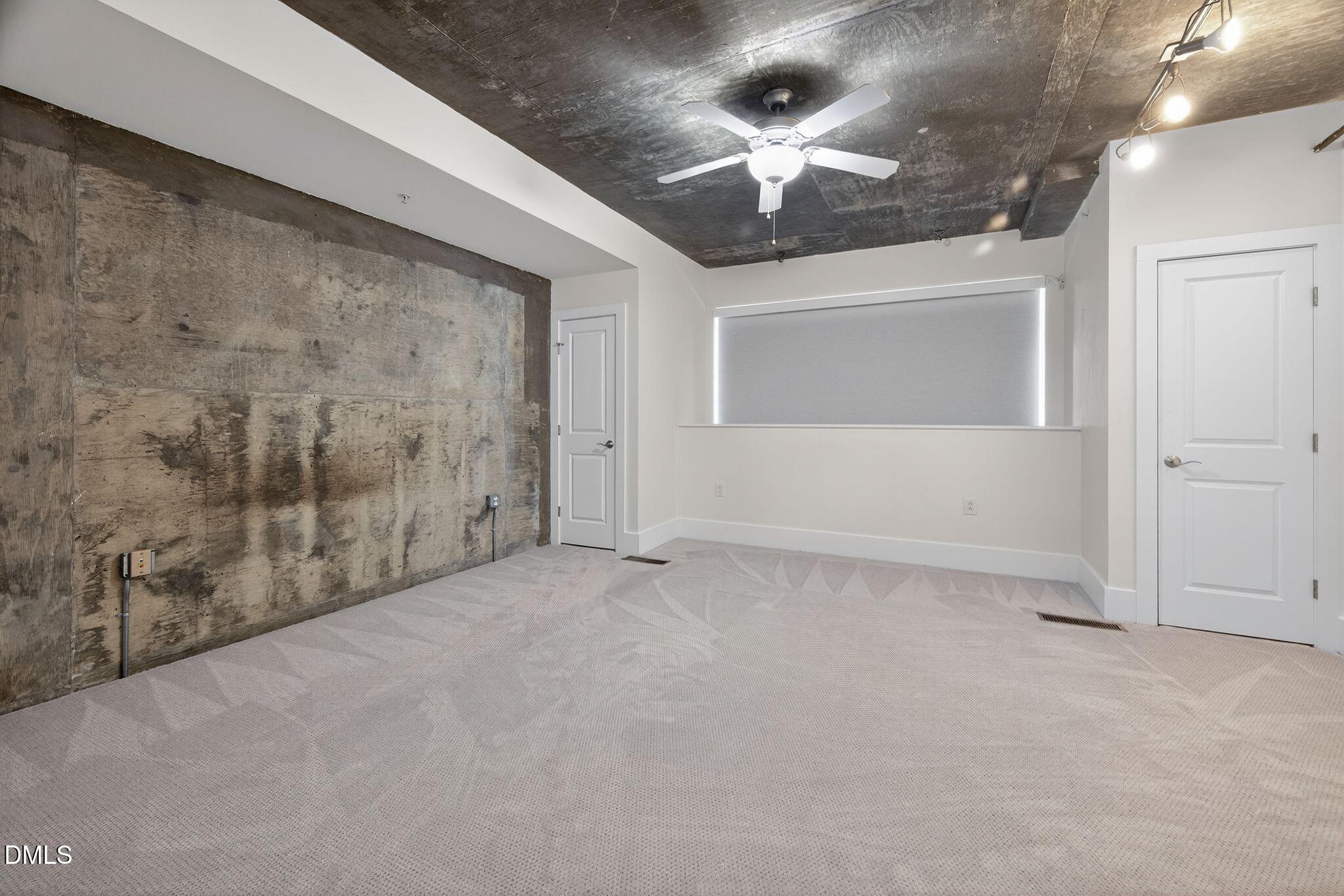 Undisclosed Address Raleigh, NC 27601 - Photo 17 of 25 wooden floor in an empty room with a chandelier