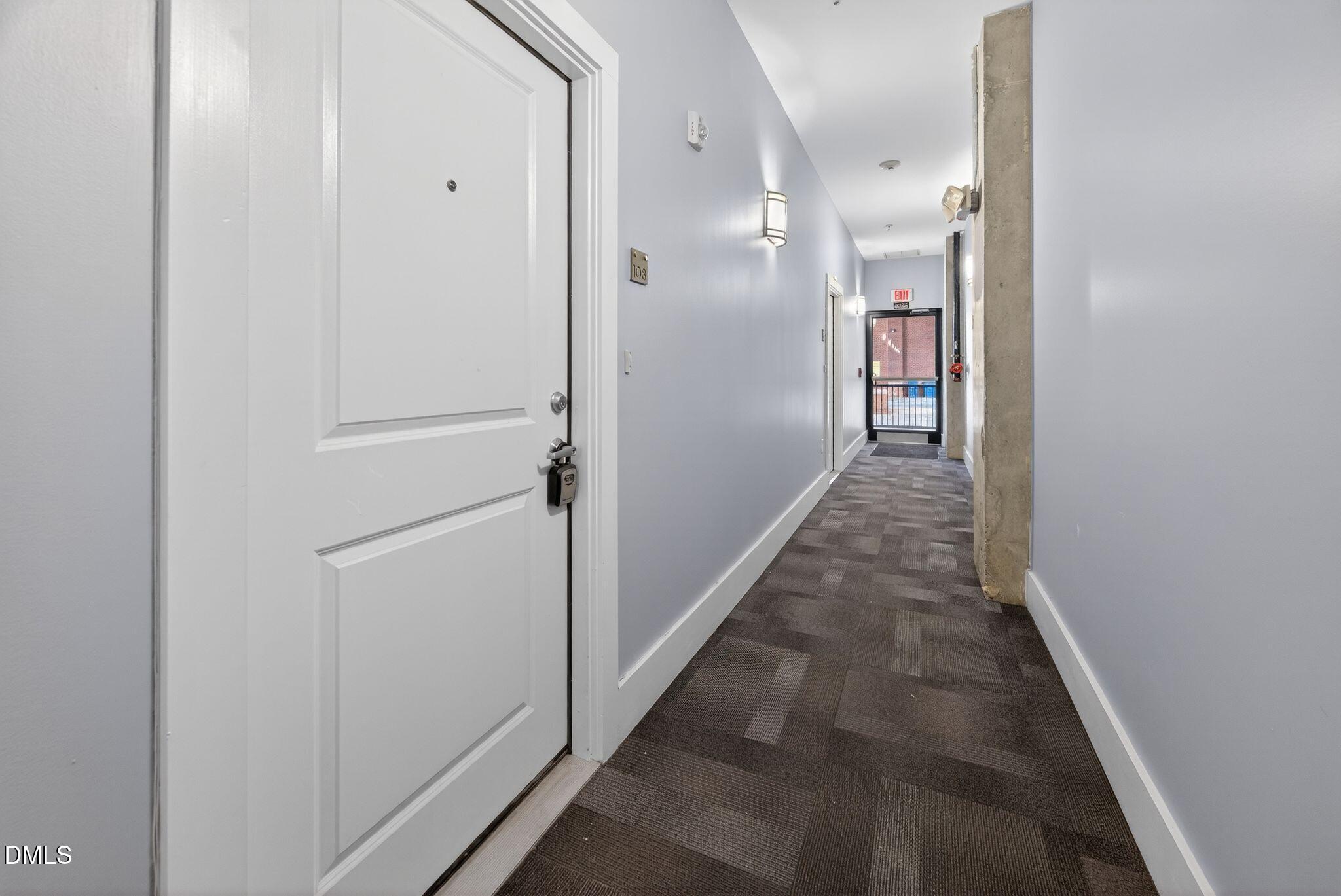Undisclosed Address Raleigh, NC 27601 - Photo 23 of 25 a view of a hallway with wooden floor