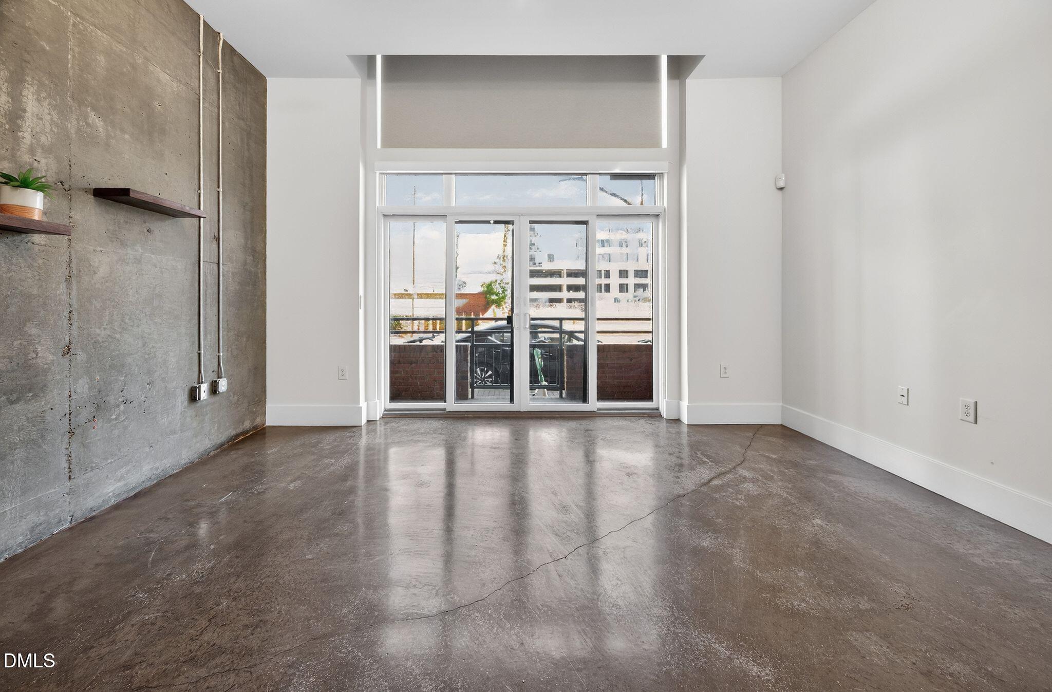Undisclosed Address Raleigh, NC 27601 - Photo 9 of 25 a view of an empty room with a window