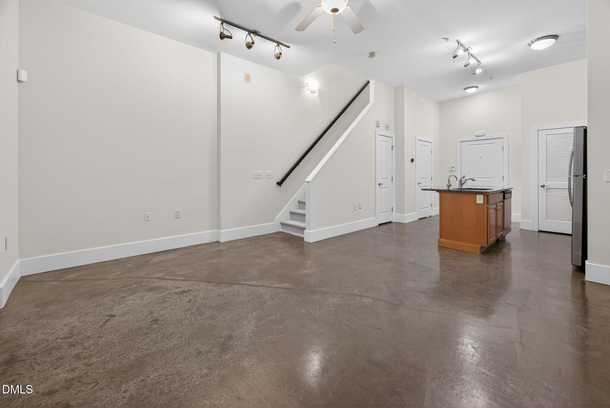 Undisclosed Address Raleigh, NC 27601 - Photo 10 of 25 an empty room with wooden floor and windows