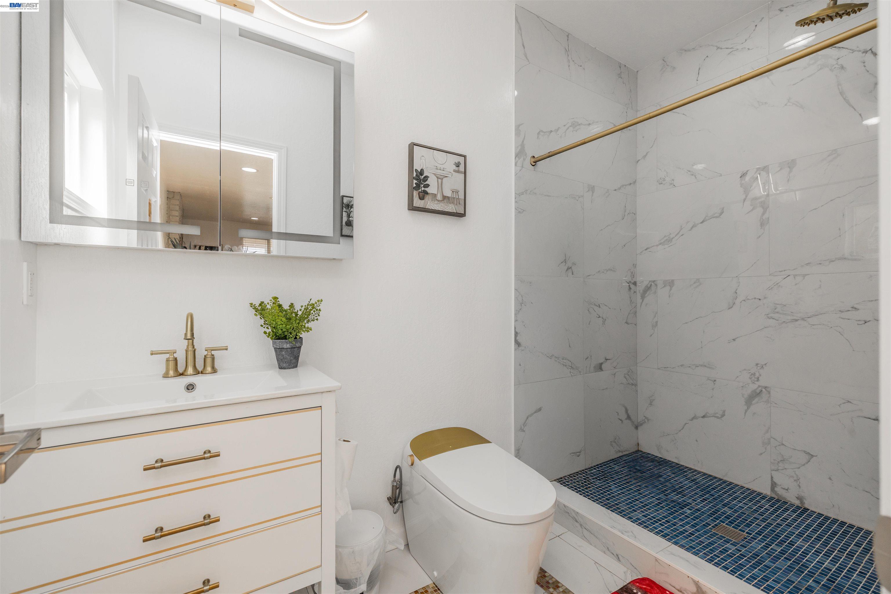4032 Doane Street Fremont, CA 94538 - Photo 10 of 39 a bathroom with a sink a toilet and mirror
