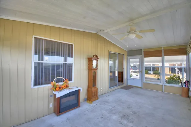 a view of a room with furniture and a window