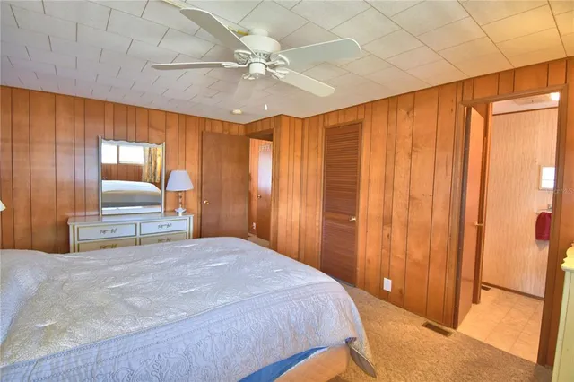 a bed room with a bed and a window