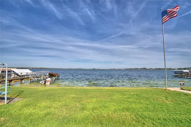 a view of a yard with a swimming pool