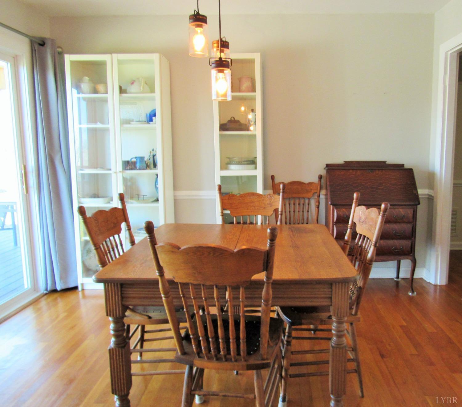 801 Gidsville Road Amherst, VA 24521 - Photo 11 of 34 a view of a dining room with furniture window and wooden floor