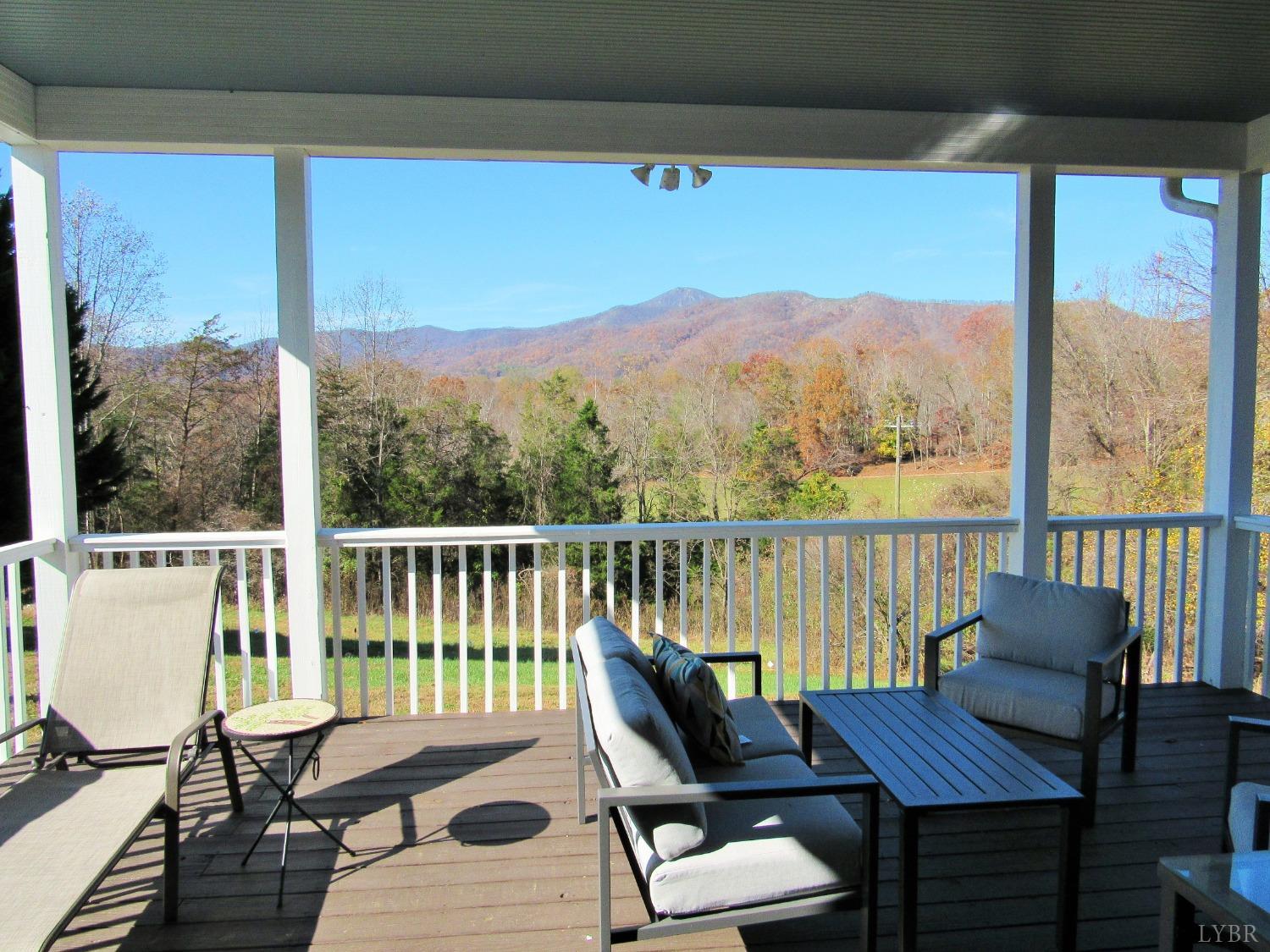 801 Gidsville Road Amherst, VA 24521 - Photo 12 of 34 a view of a balcony with chairs and wooden floor