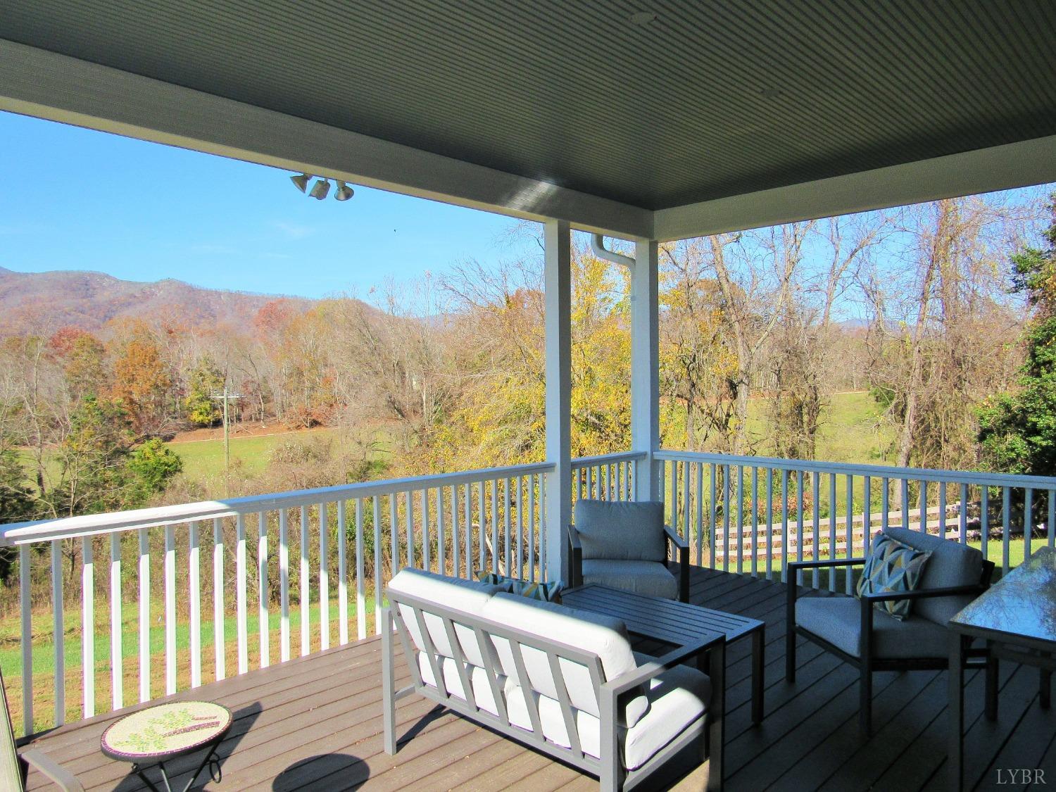 801 Gidsville Road Amherst, VA 24521 - Photo 13 of 34 a view of a chair and table in the balcony