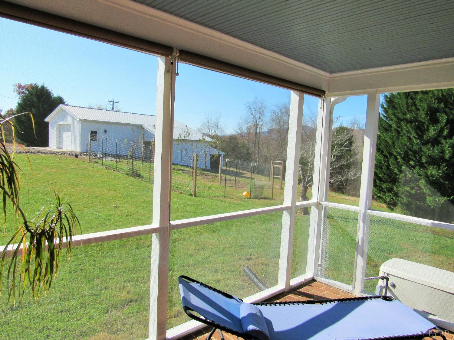 801 Gidsville Road Amherst, VA 24521 - Photo 16 of 34 a view of a balcony with chair and floor to ceiling window