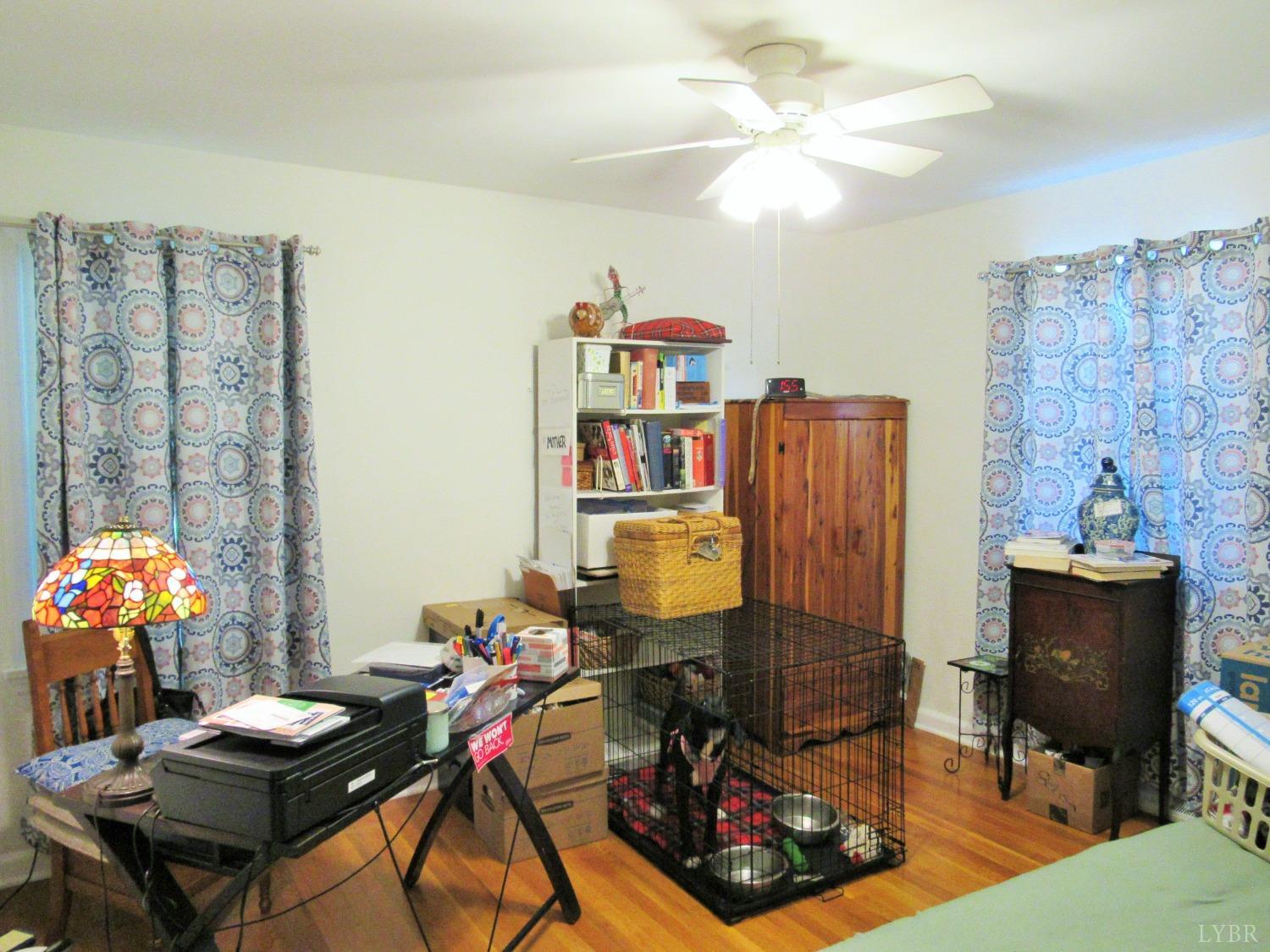 801 Gidsville Road Amherst, VA 24521 - Photo 18 of 34 a view of a workspace with furniture and a flat screen tv