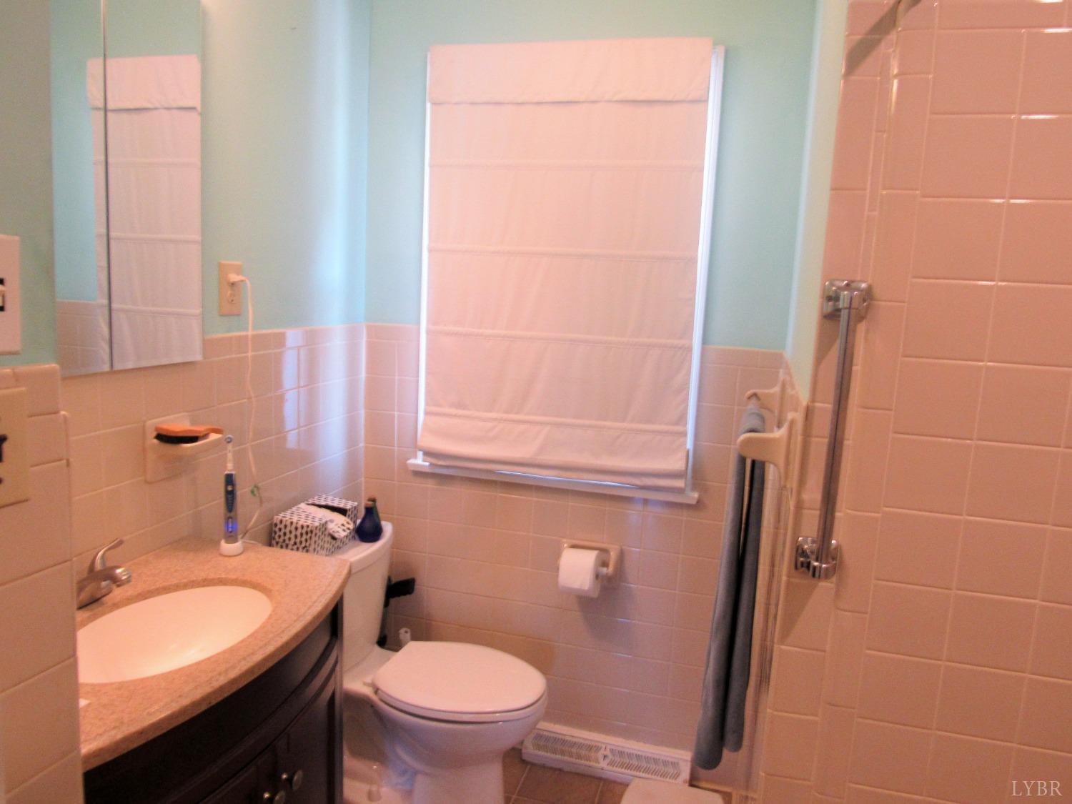 801 Gidsville Road Amherst, VA 24521 - Photo 20 of 34 a bathroom with a granite countertop sink toilet and shower