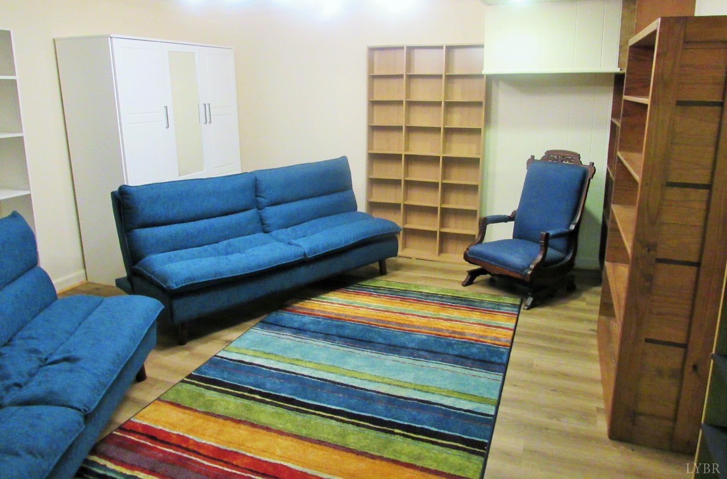 801 Gidsville Road Amherst, VA 24521 - Photo 22 of 34 a living room with furniture and a rug