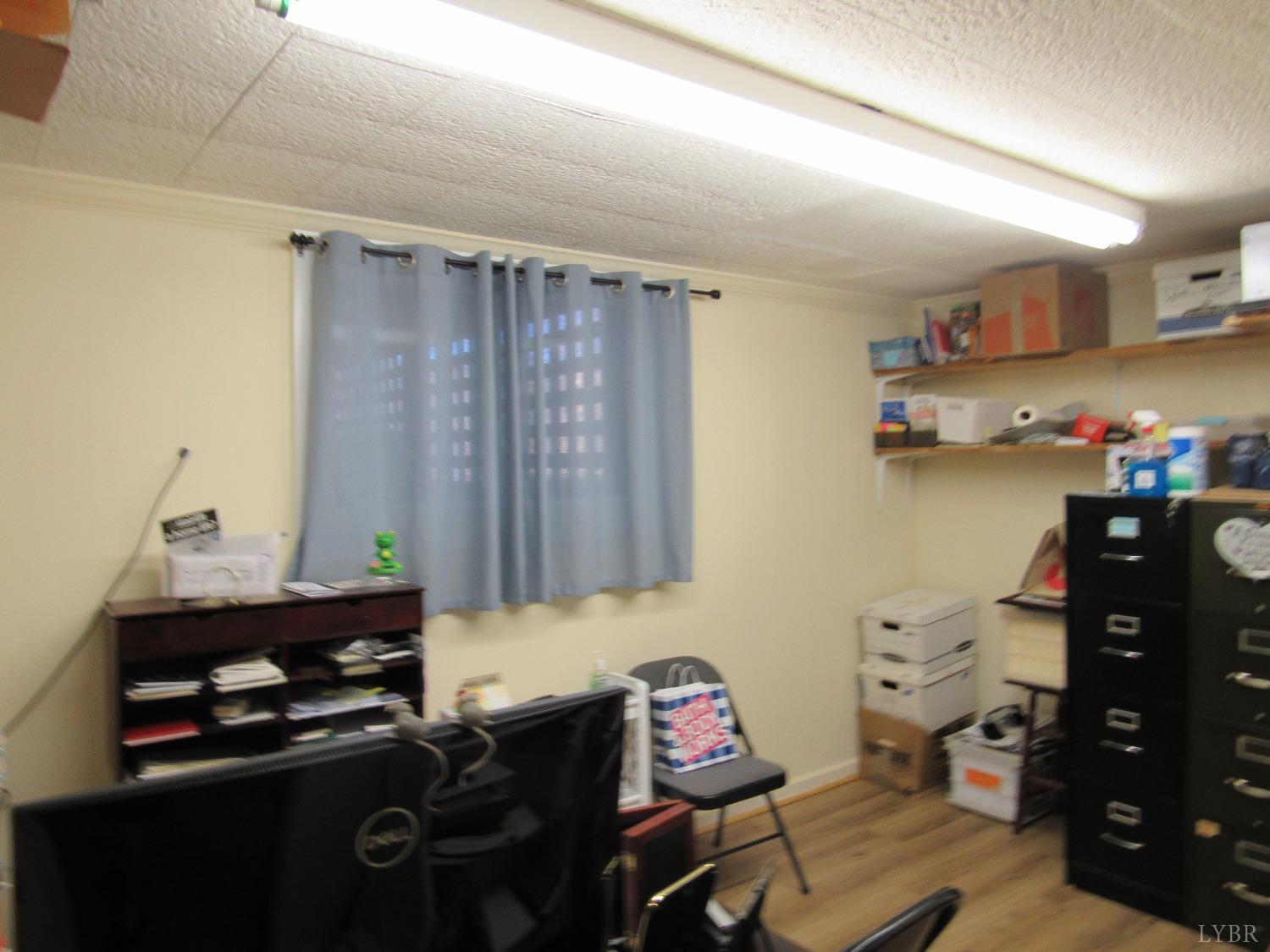 801 Gidsville Road Amherst, VA 24521 - Photo 23 of 34 a room with furniture and wooden floor