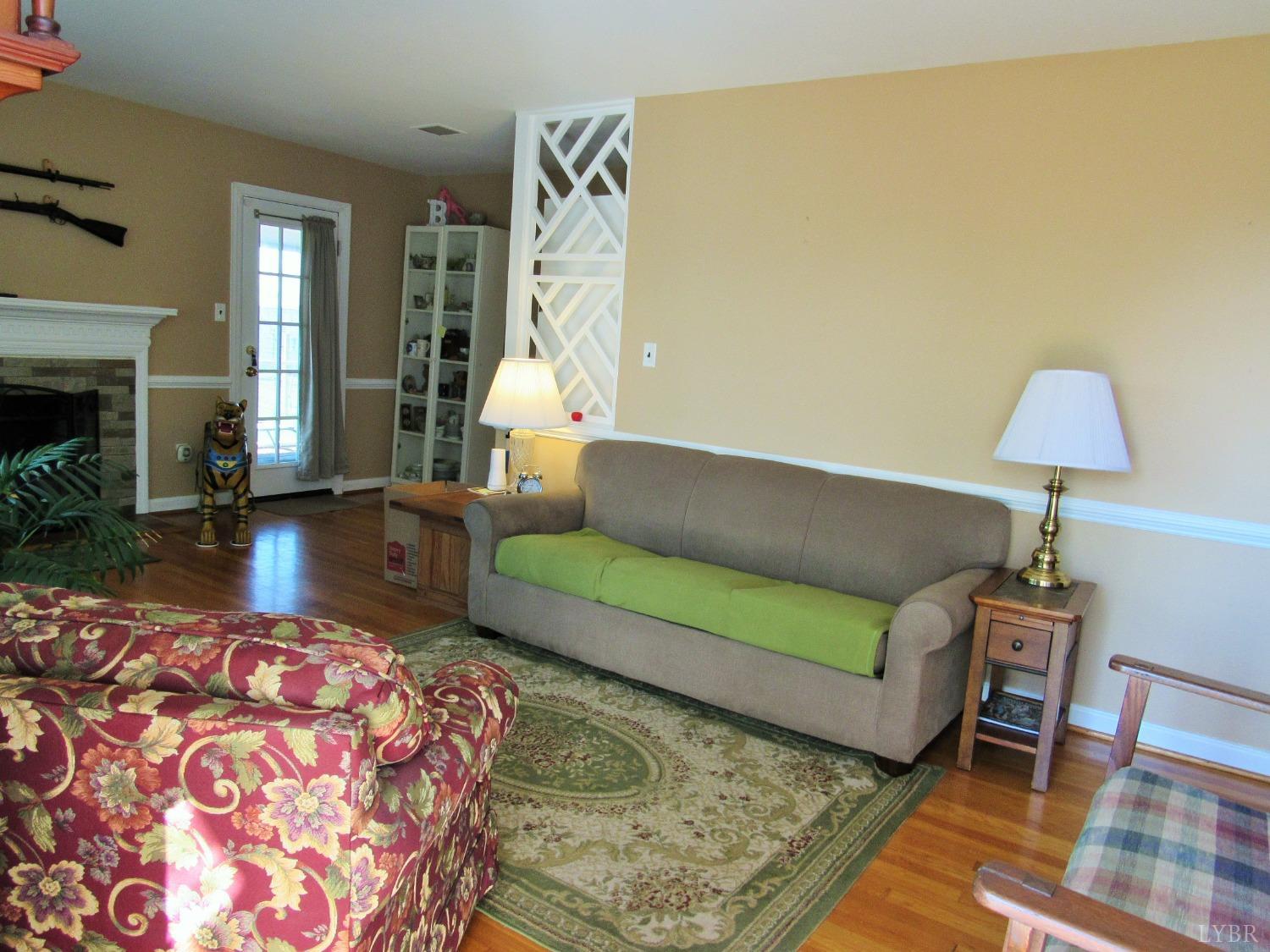 801 Gidsville Road Amherst, VA 24521 - Photo 7 of 34 a living room with furniture and a fireplace