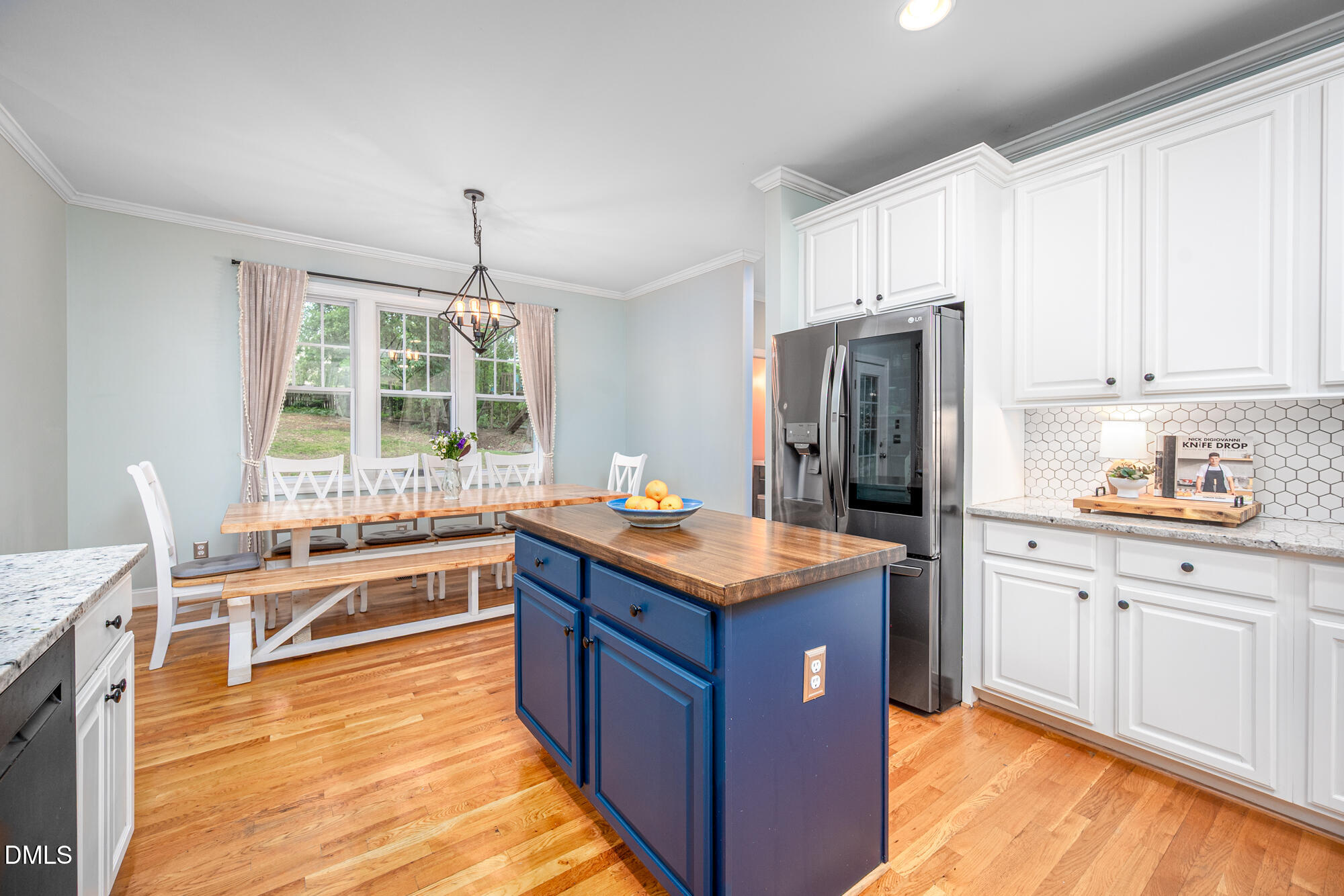 726 Ruth Circle Fuquay-Varina, NC 27526 - Photo 19 of 61 a kitchen with stainless steel appliances granite countertop a stove refrigerator and window